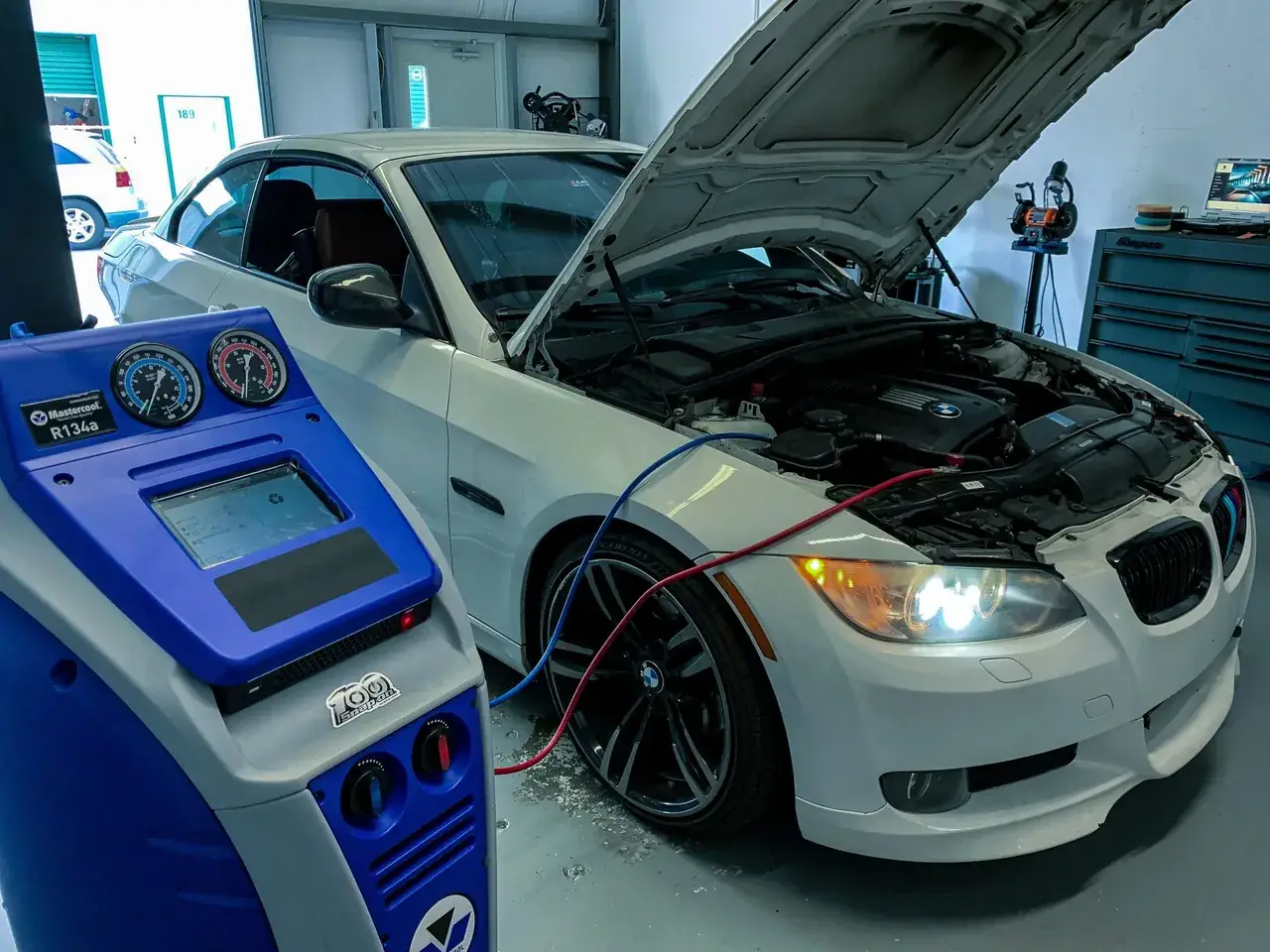 European car undergoing air conditioning service inside the Hyperformance Garage service bay